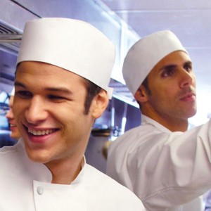 The image features chef wearing hats and hairnets