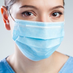 Image features a nurse wearing a Mask  