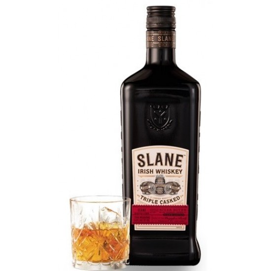 Bottle of Slane Whiskey with a glass