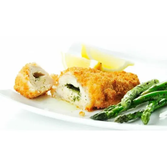 Sliced Garlic & Herb Chicken Kiev in a pool of garlic butter, paired with asparagus and lemon wedges
