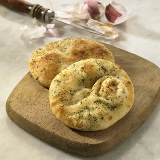 Baked Earth Mini Garlic &  Corriander Naan Breads on a Board